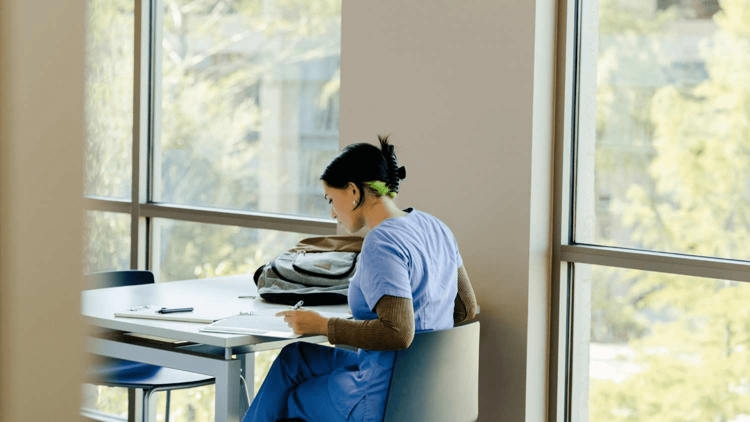 Medical student studying for her shelf exams while on break during her clinical rotation.
